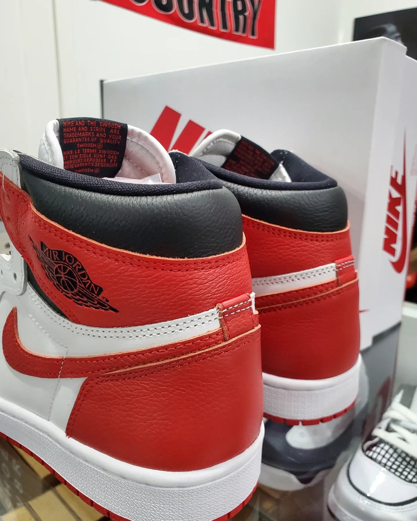 Jordan 1 with red stripe on sale